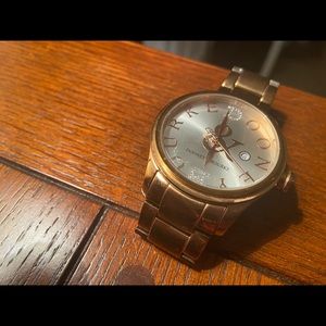 Dooney and Burke rose gold bracelet style watch.